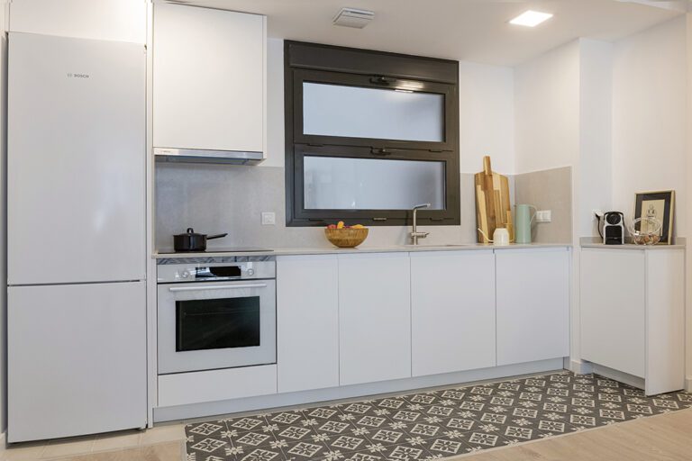 Modern kitchen with appliances and decor items.