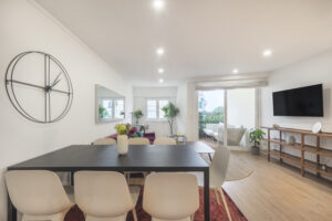 Dining room and living room with modern furnishings.