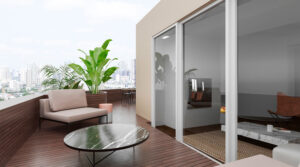 Modern balcony with seating and city view.