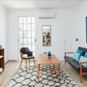 Modern living room with stylish furniture and decor.