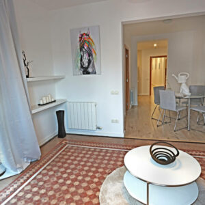 Cozy interior with colorful horse artwork.